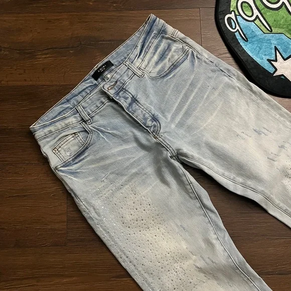 Amiri Light Wash Distressed Skinny Jeans